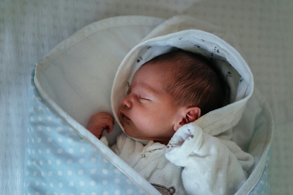 Swaddle baby in slumber.